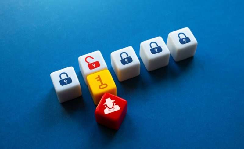 Intruder gains access to secrets. Hacker hacking into the security system. Data leakage, industrial espionage. Crypto theft, computer viruses. Authentication. Electronic encryption key.